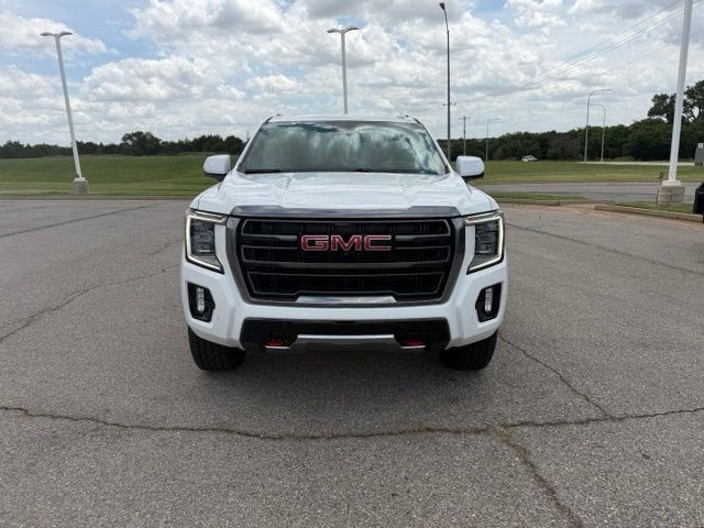 2024 GMC Yukon AT4 in Summit White — front three-quarter view