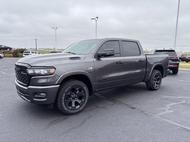 2026 RAM Ram 1500 RAM 1500 BIG HORN CREW CAB 4X4 5'7' BOX in Granite Crystal Metallic Clear-Coat Exterior Paint — front three-quarter view