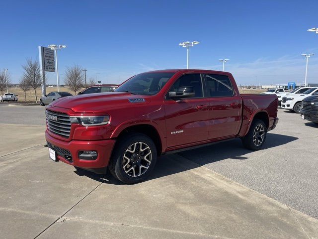 2026 RAM Ram 1500 RAM 1500 LARAMIE CREW CAB 4X4 5'7' BOX in Molten Red Pearl-Coat Exterior Paint — front three-quarter view