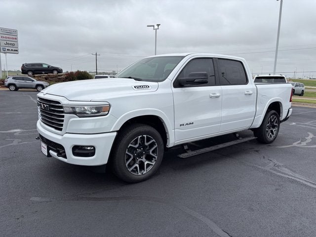 2026 RAM Ram 1500 RAM 1500 LARAMIE CREW CAB 4X4 5'7' BOX in Bright White Clear-Coat Exterior Paint — front three-quarter view