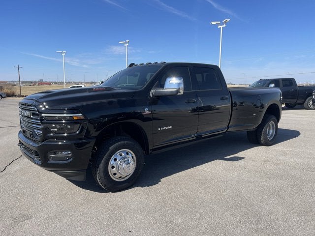 2026 RAM Ram 3500 RAM 3500 LARAMIE CREW CAB 4X4 8' BOX in Diamond Black Crystal Pearl-Coat Exterior Paint — front three-quarter view