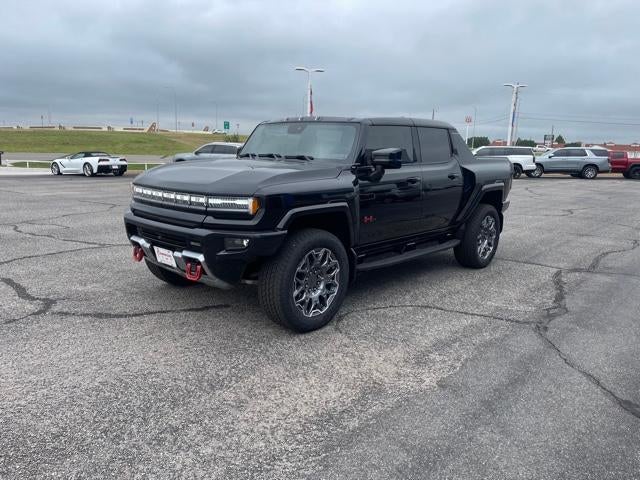 2025 GMC HUMMER EV Pickup 2X in Void Black — front three-quarter view