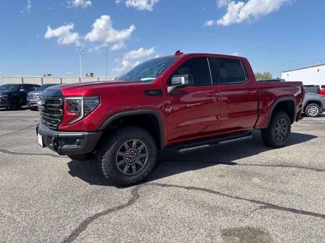 2026 GMC Sierra 1500 AT4X in Volcanic Red Tintcoat — front three-quarter view